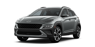 Silver Hyundai SUV with sleek design and modern headlights, parked at an angle.