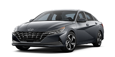 Sleek dark gray sedan with a modern design, featuring sharp headlights and a distinctive front grille.