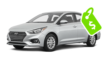 Silver Hyundai sedan with a green price tag icon in the corner, indicating affordability.